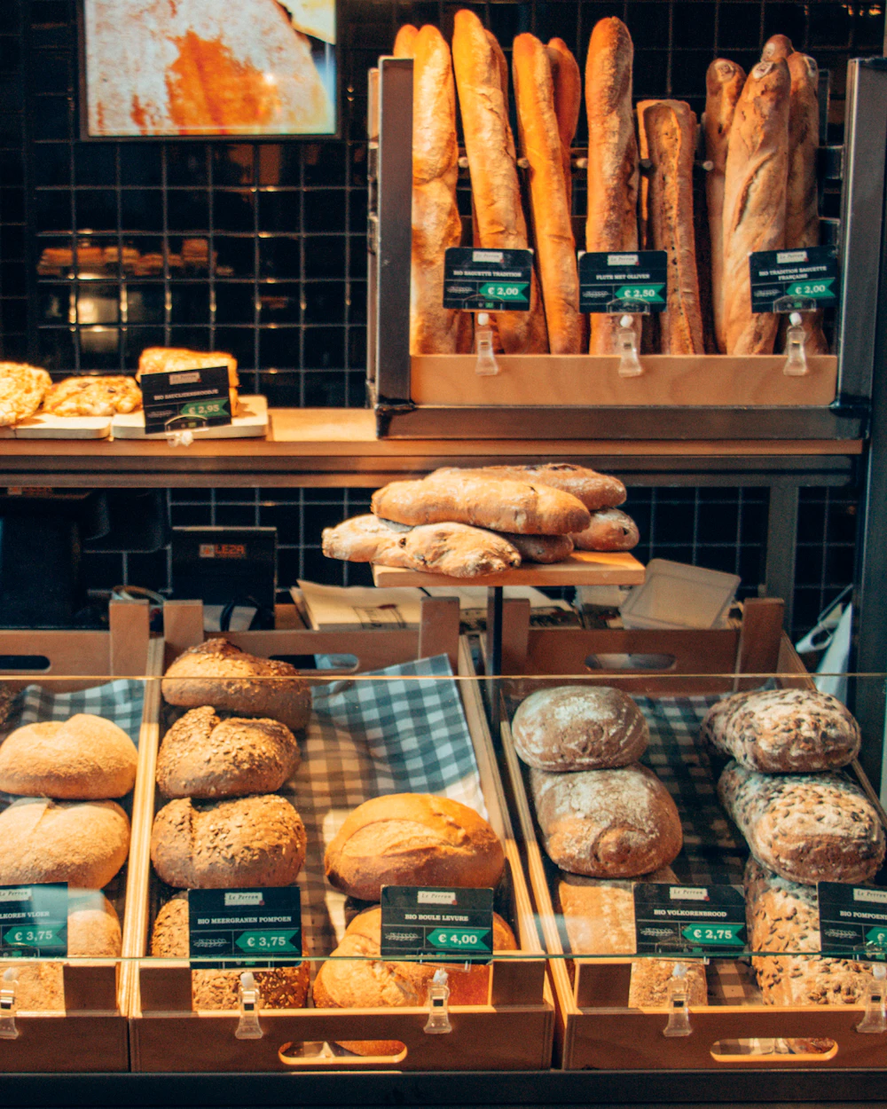 Shelves of fresh loaves and pastries inside the bakery